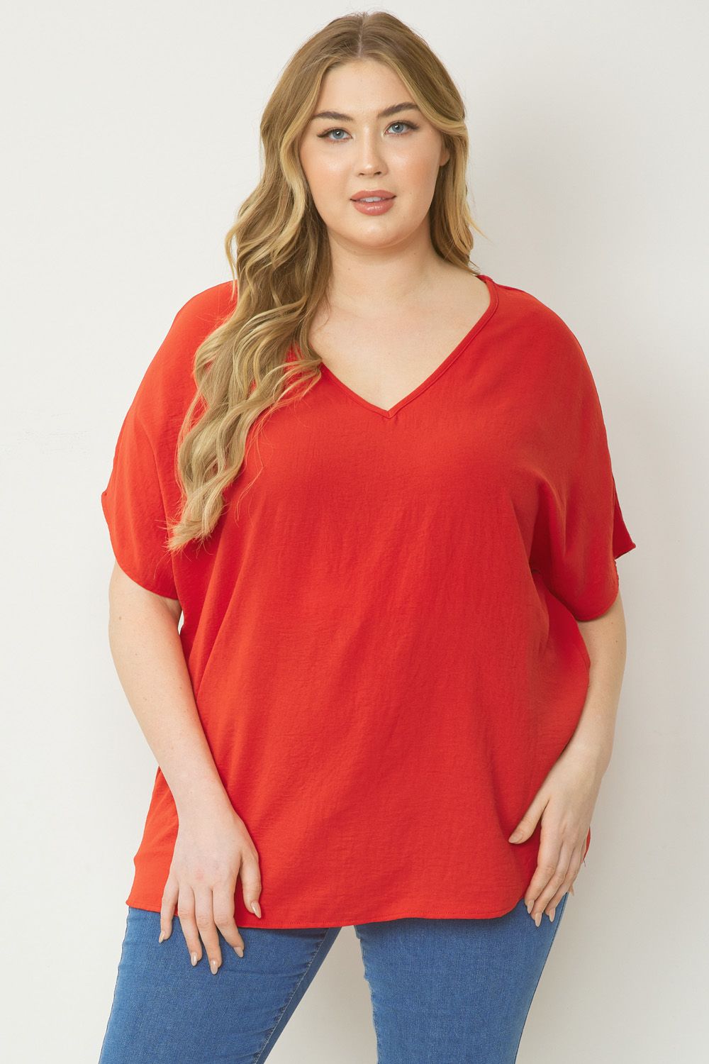 Women's red basic v-neck shirt.