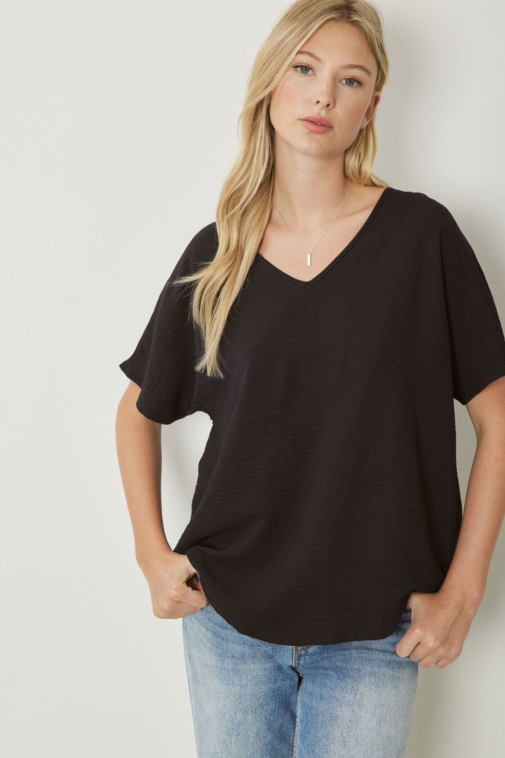 Women's black basic v-neck shirt.