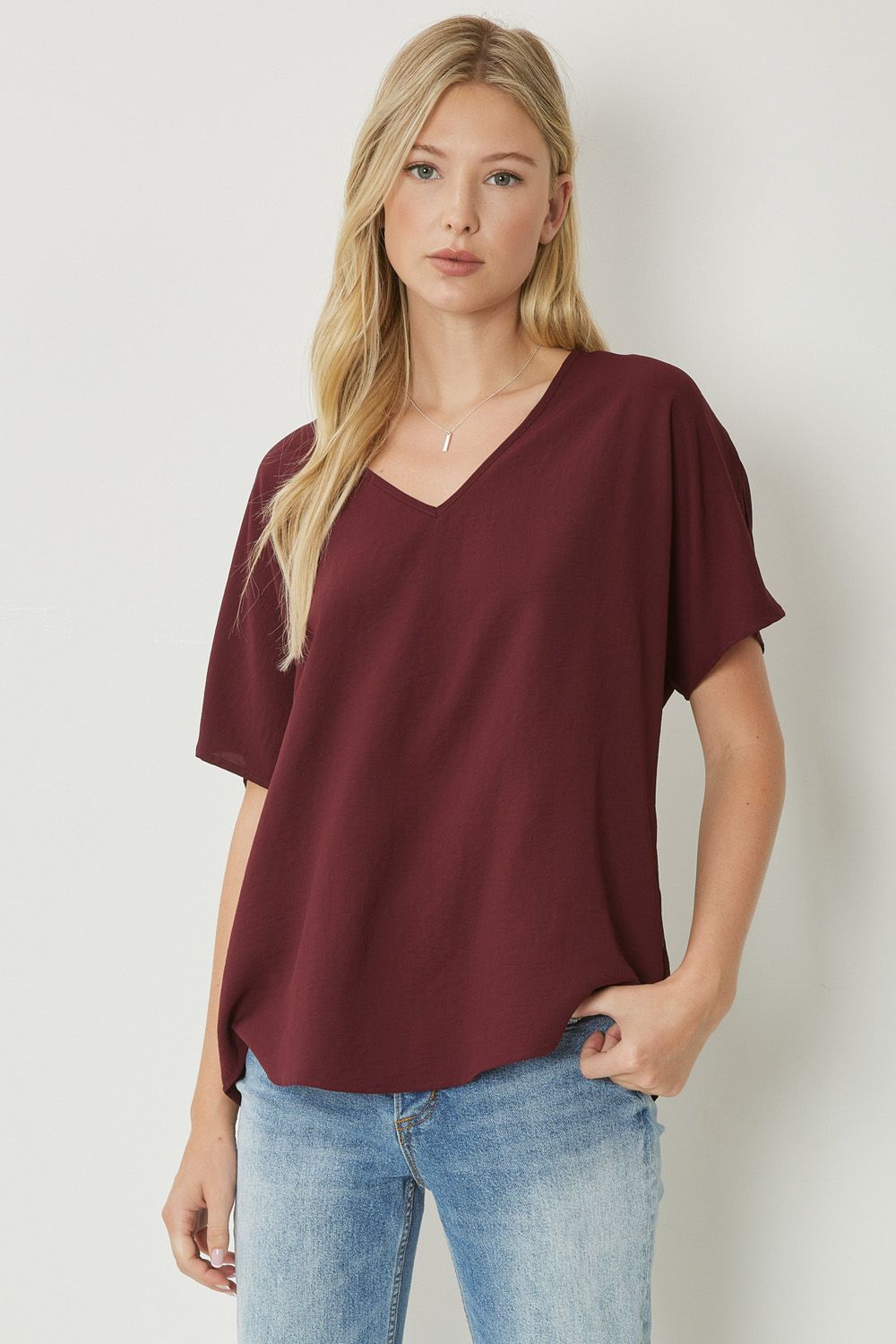 Women's burgundy basic v-neck shirt.