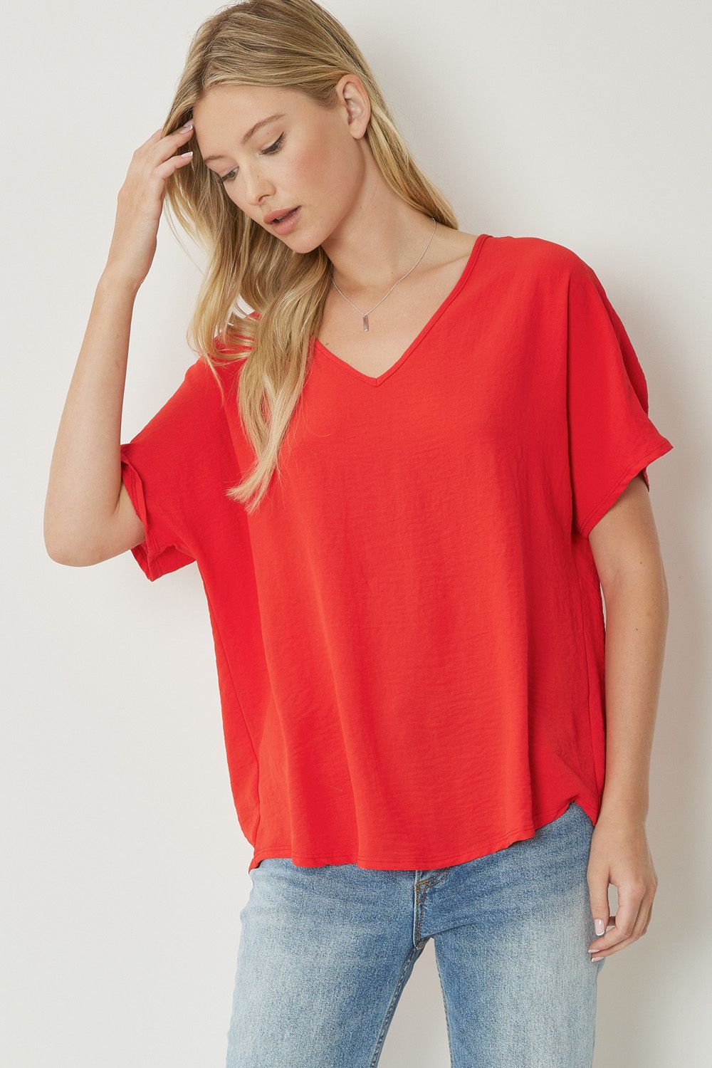 Women's red basic v-neck shirt.