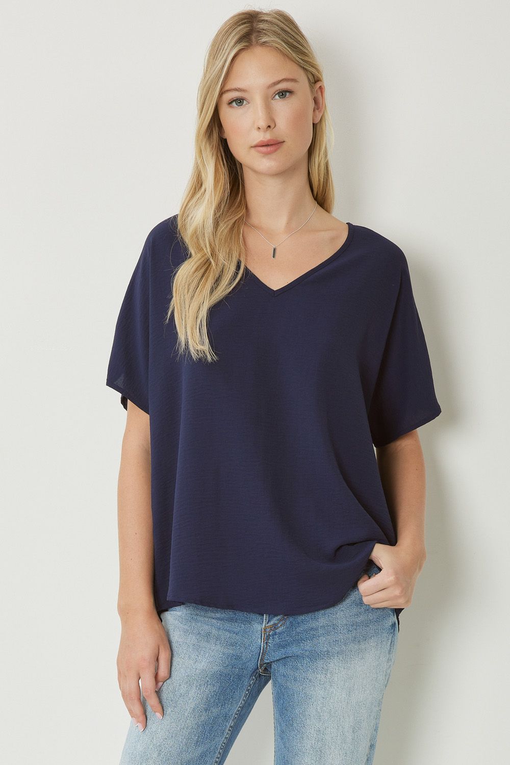 Women's navy blue basic v-neck shirt.