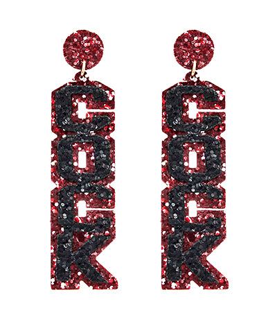 Glitter dangling earrings featuring "COCK" in garnet and black.