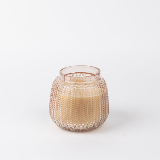 Candle in a globe-shaped jar with lilac hues.