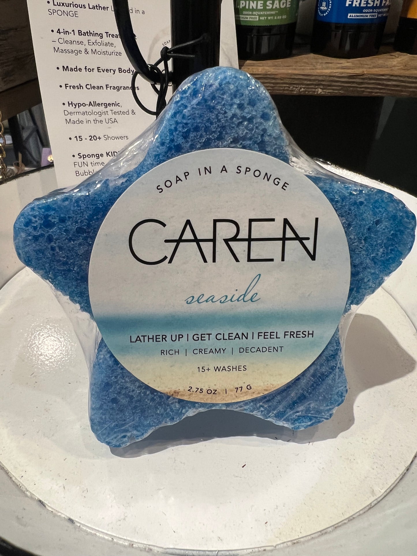 Caren "Seaside" soap sponge shaped like a blue star.