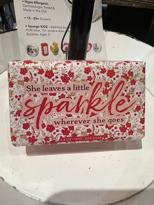 Bar soap in red floral wrapping. "She leaves a sparkle wherever she goes".