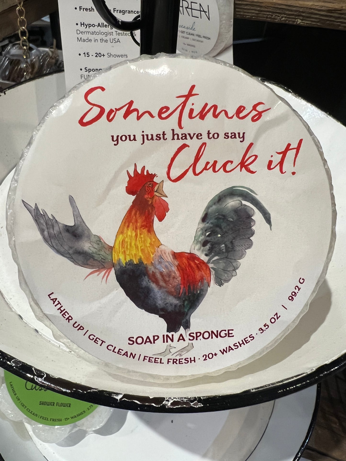 Caren "Sometimes you just have to say cluck it" soap sponge. White and round.