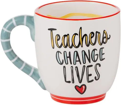 White handmade mug with a blue handle featuring "Teachers change lives".