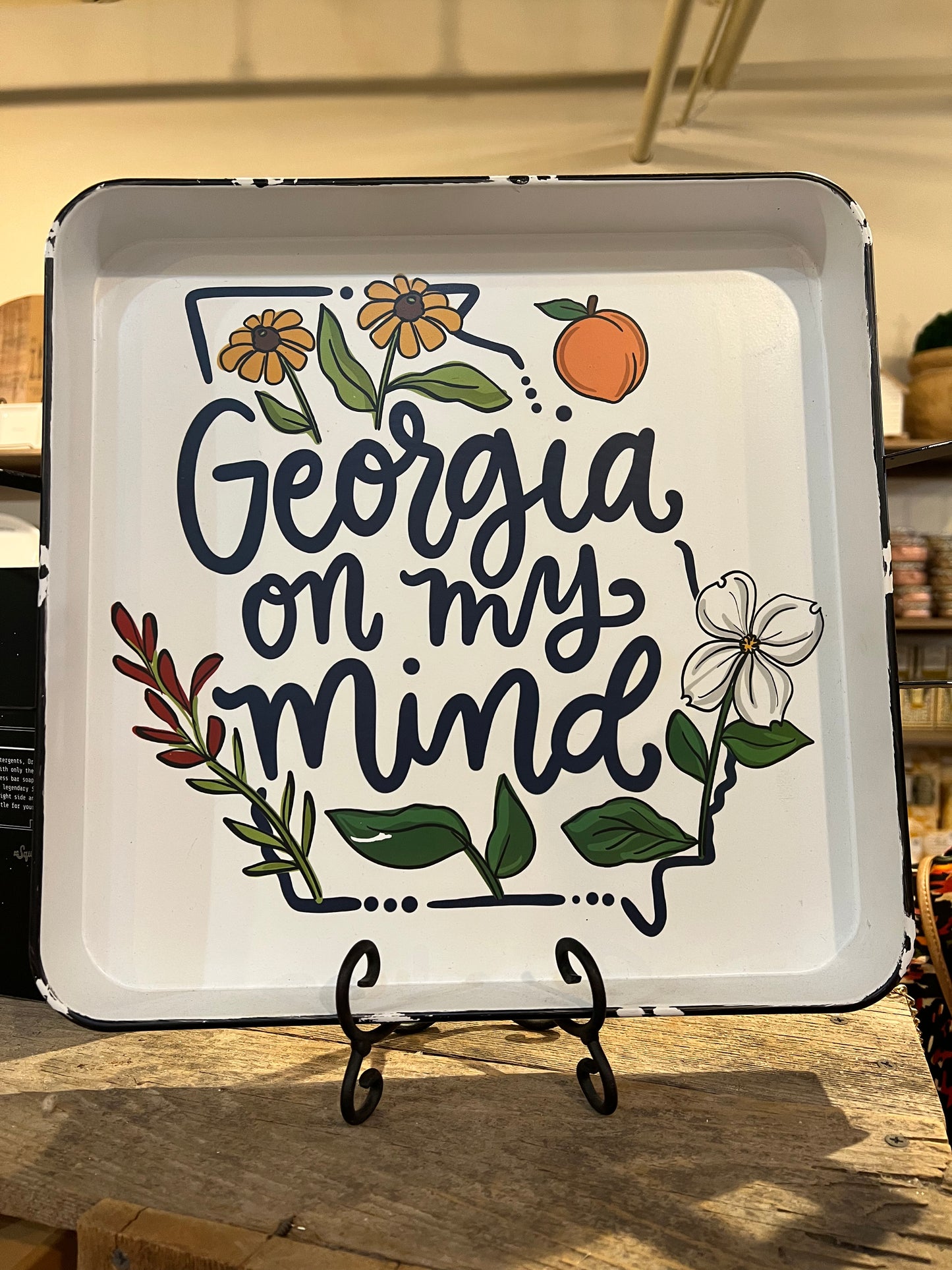 White tray with the outline of Georgia featuring depictions of the state and "Georgia on my mind".