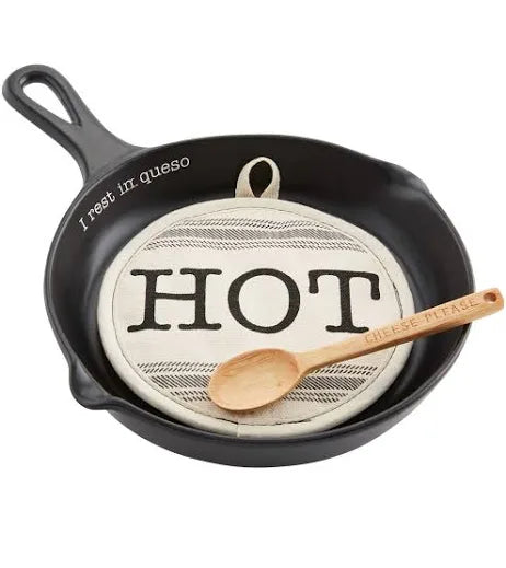 "I rest in queso" skillet with "HOT" potholder and "cheese please" wooden spoon.