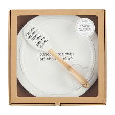 White "(Chocolate) chip off the old block" plate with wooden spatula and cookie cutter .