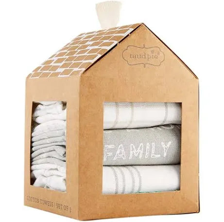 Set of kitchen towels in neutral colors, wrapped in a package designed to mimic a house.