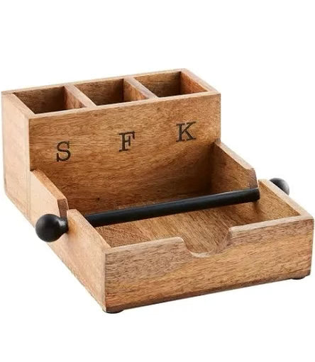 Wooden utensil holder with engraved" S,F,K" and a black metal bar to hold napkins.