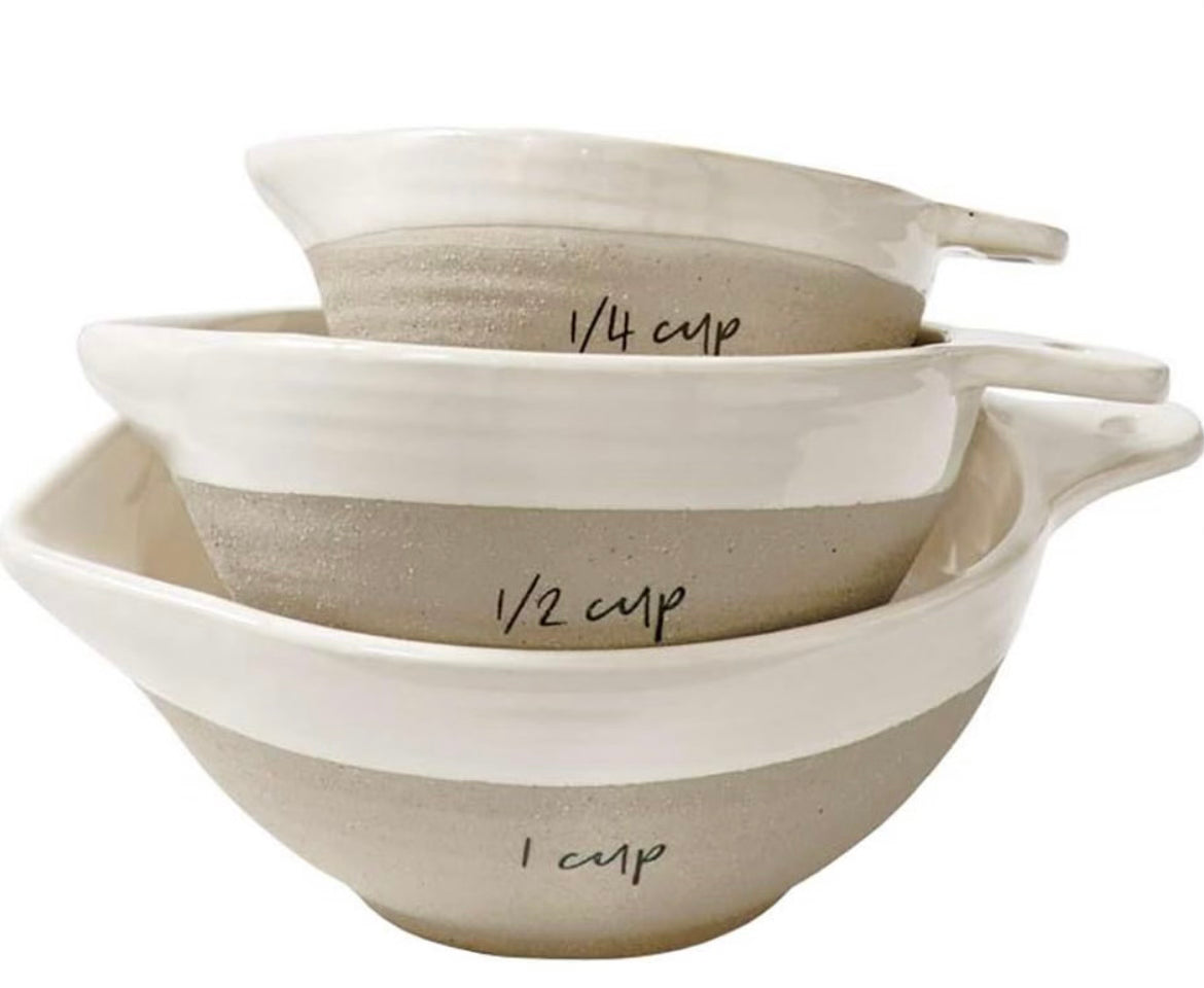 Set of 3 stone and ceramic measuring cups stacked in one another.