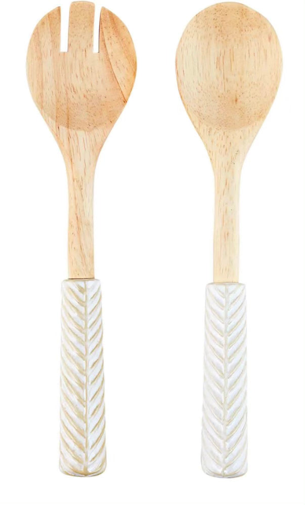 Wooden utensil set with white, glazed ceramic textured handles.