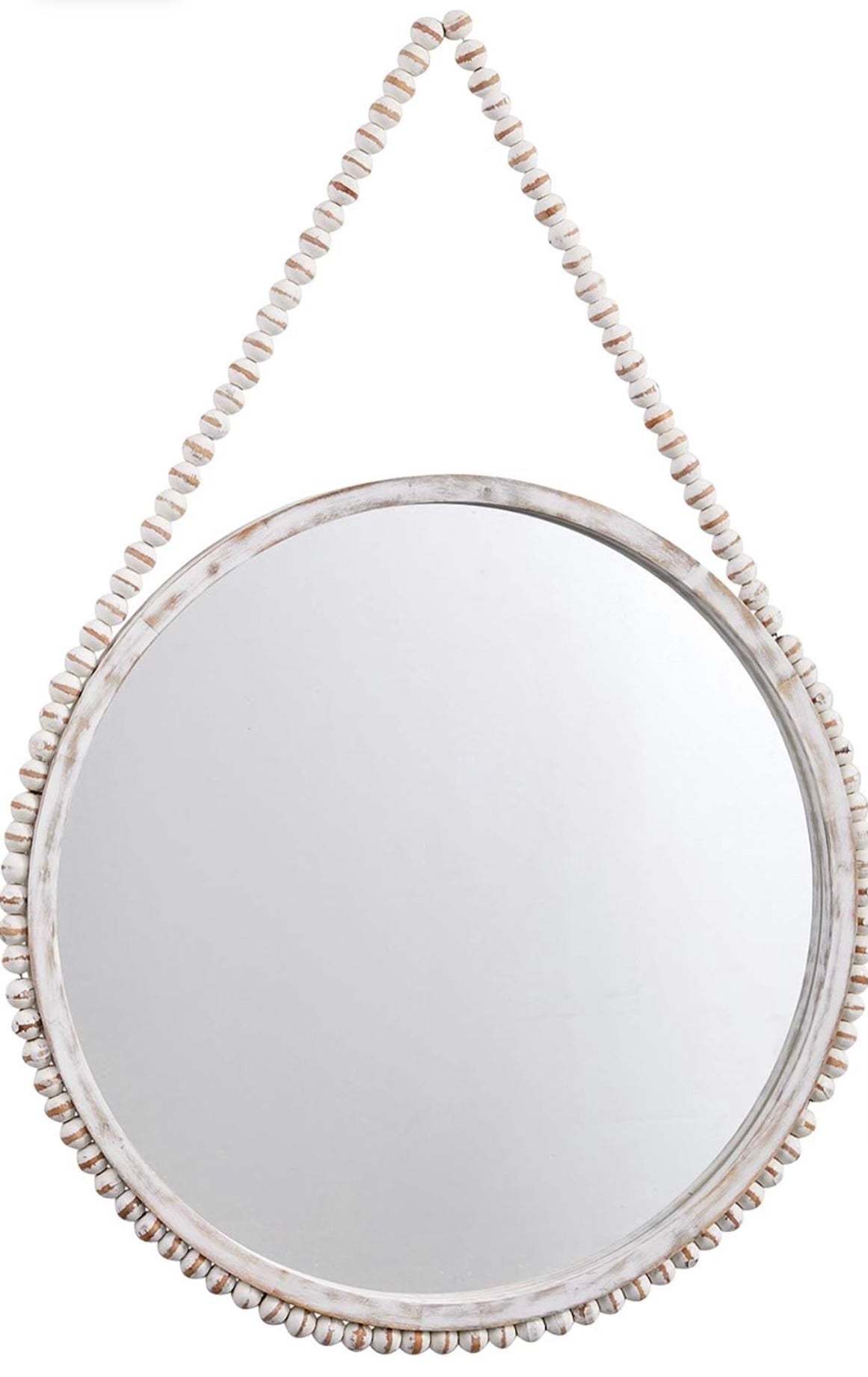 Round wall mirror with white-washed edges hung by a beaded hanger.