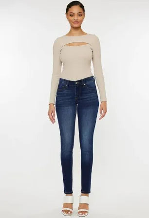 Model featuring medium wash skinny jeans.