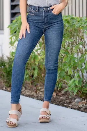 Model featuring frayed skinny jeans.