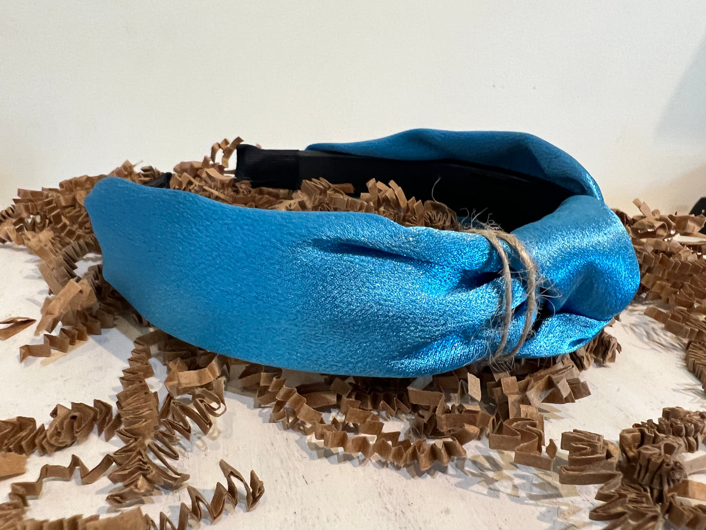 Sky blue satin headand.