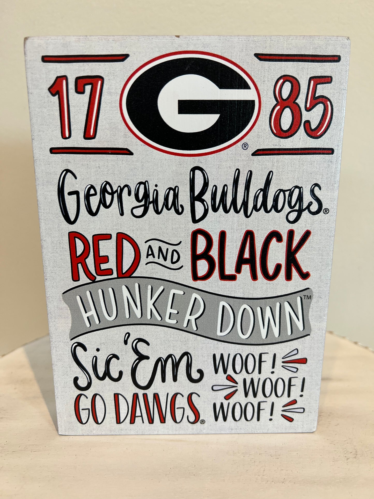 University of Georgia Collegiate Wooden Sign. "1785; Georgia Bulldogs; Red and Black; Hunker Down; Sic 'Em; Woof! Woof! Woof!; Go Dawgs'.