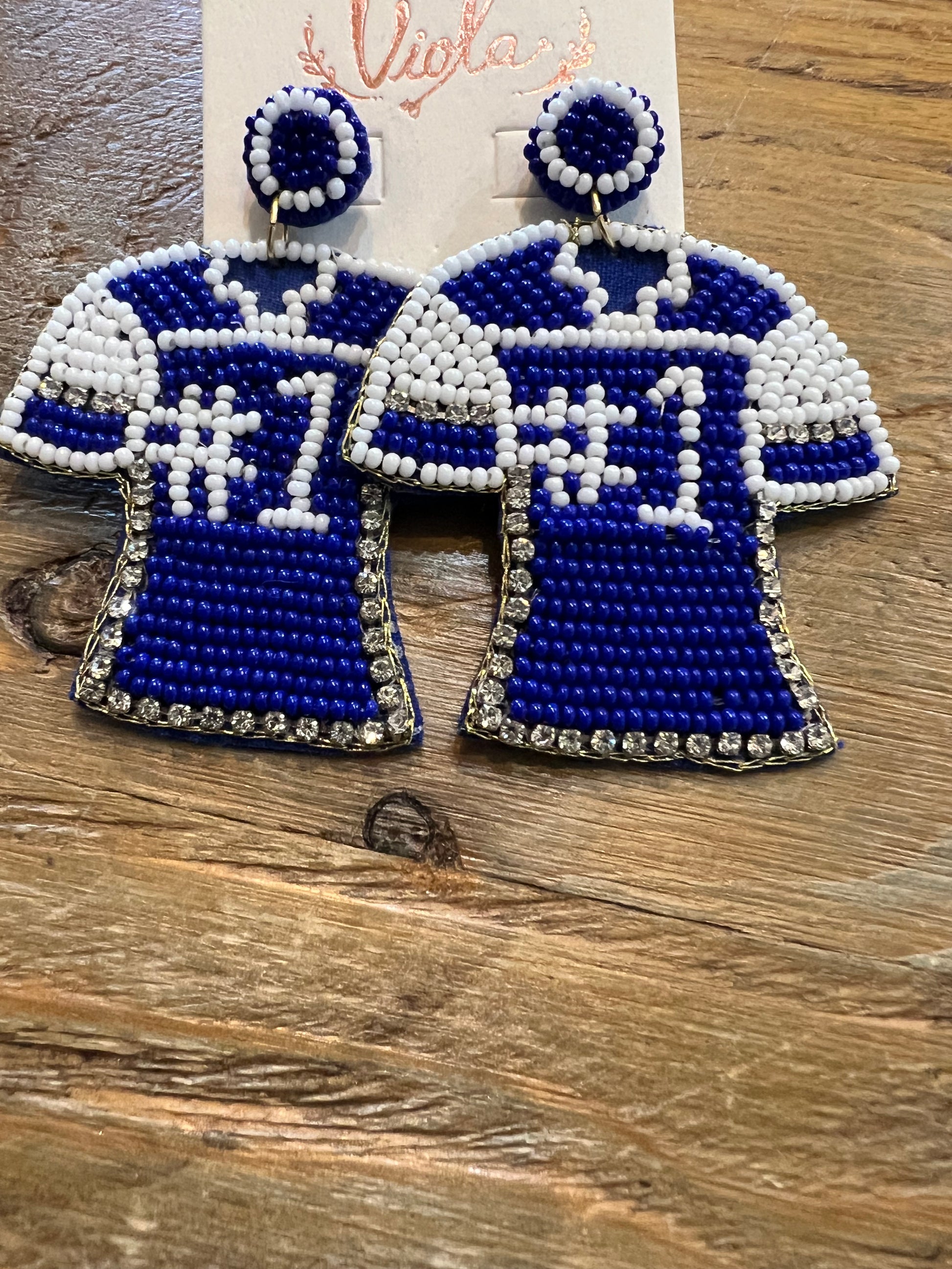 Beaded jersey earrings featuring "#1" in blue and white.