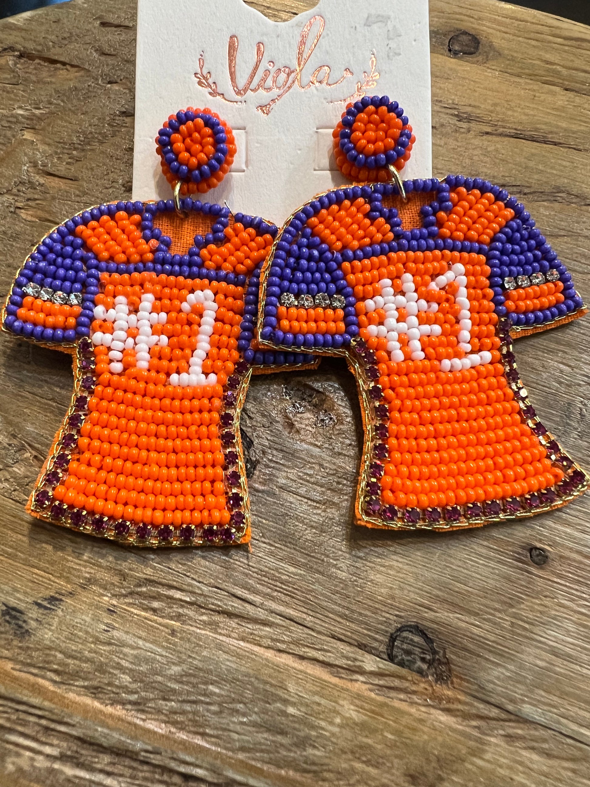 Beaded jersey earrings featuring "#1" in orange and purple.