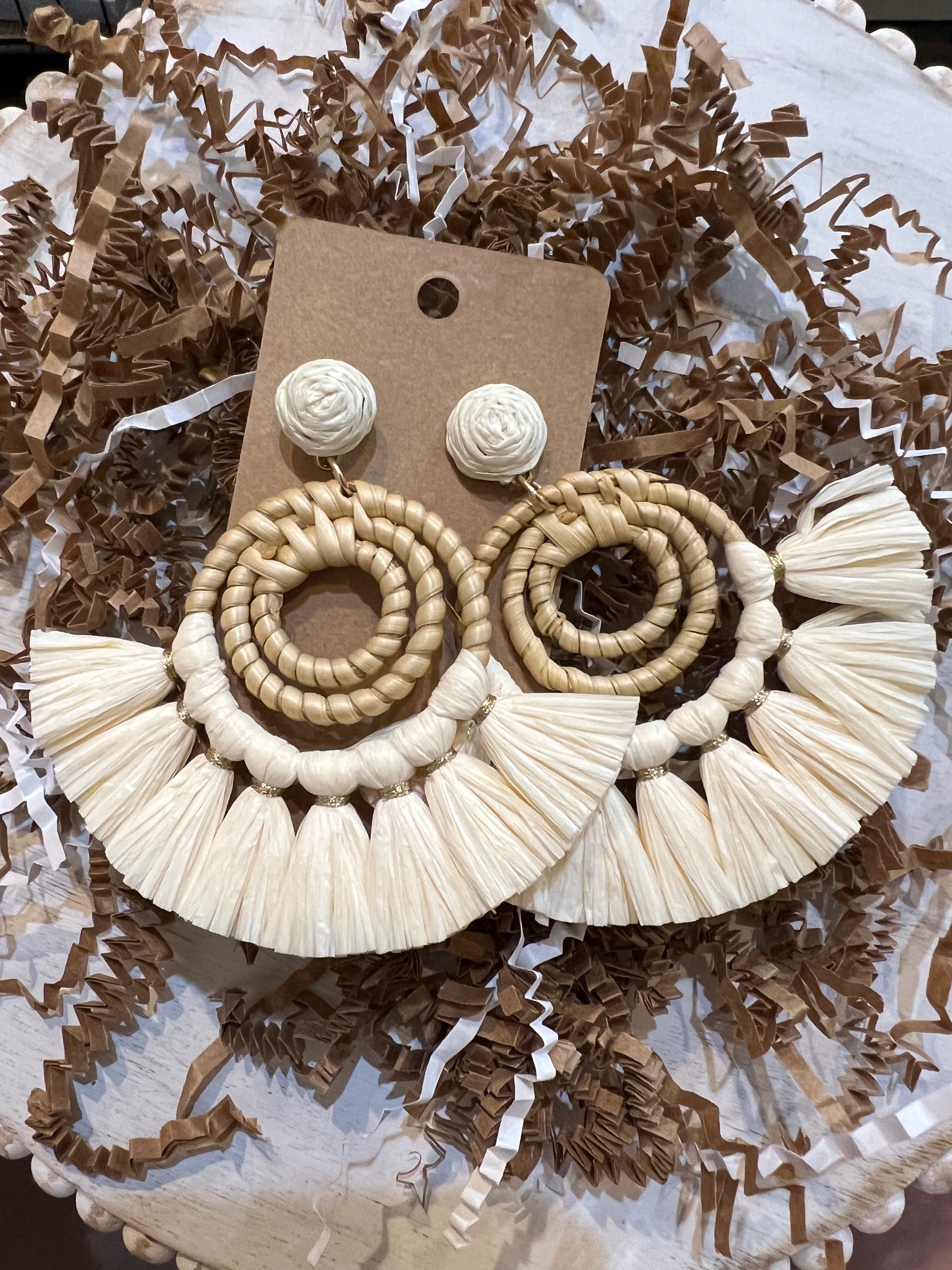 Cream raffia tassel bamboo earrings.