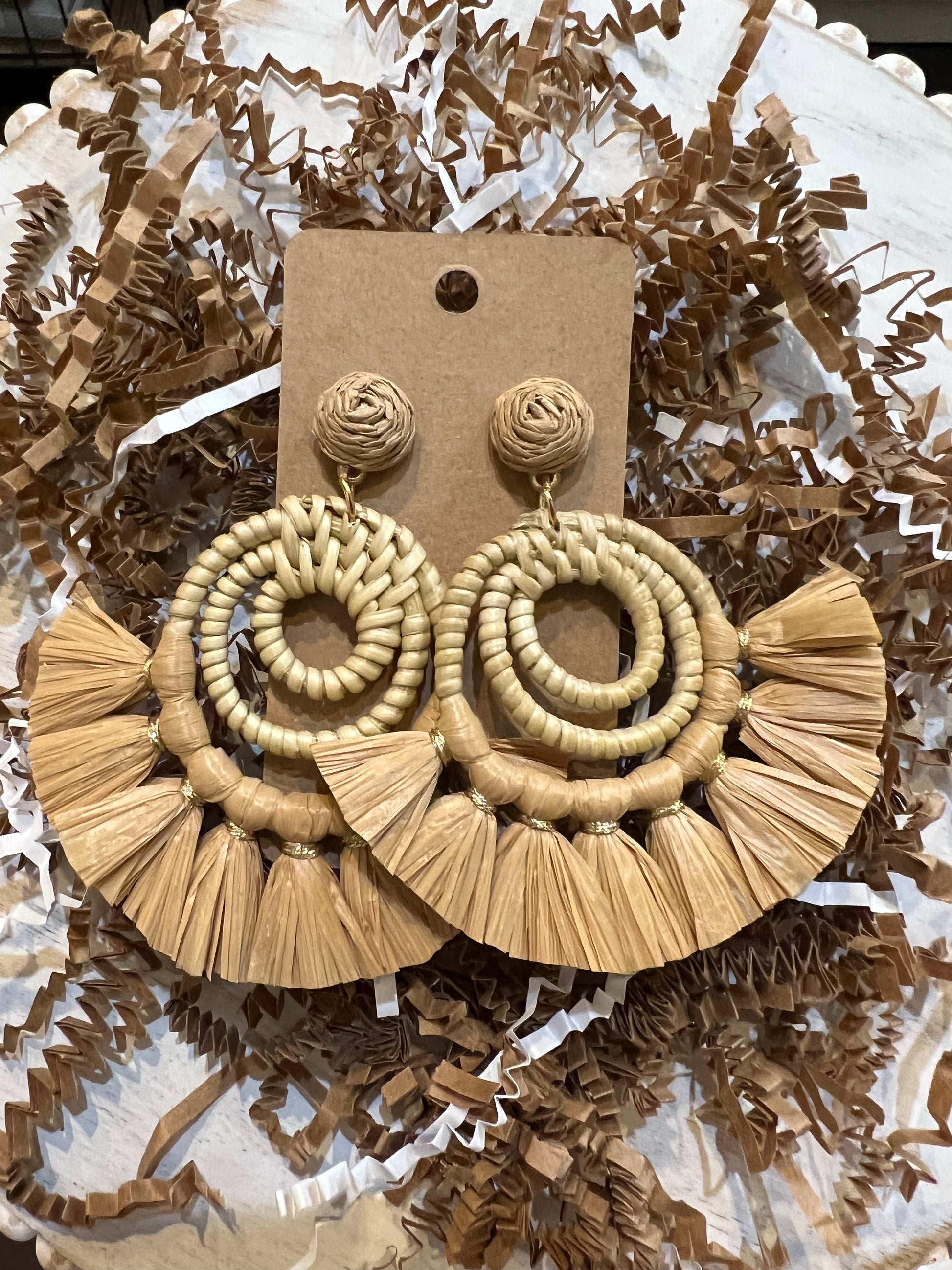 Tan raffia tassel bamboo earrings.