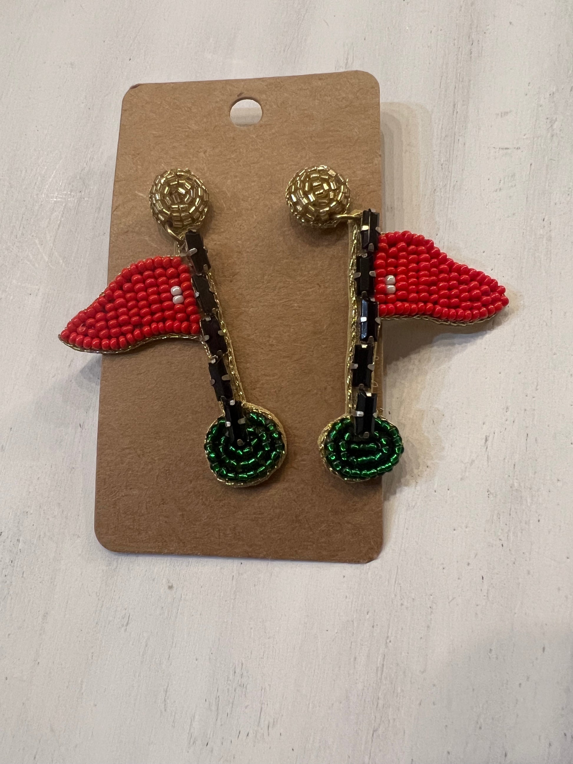 Beaded earrings shaped like golf flags.