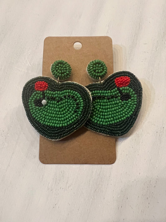 Beaded earrings depicting a putting green.