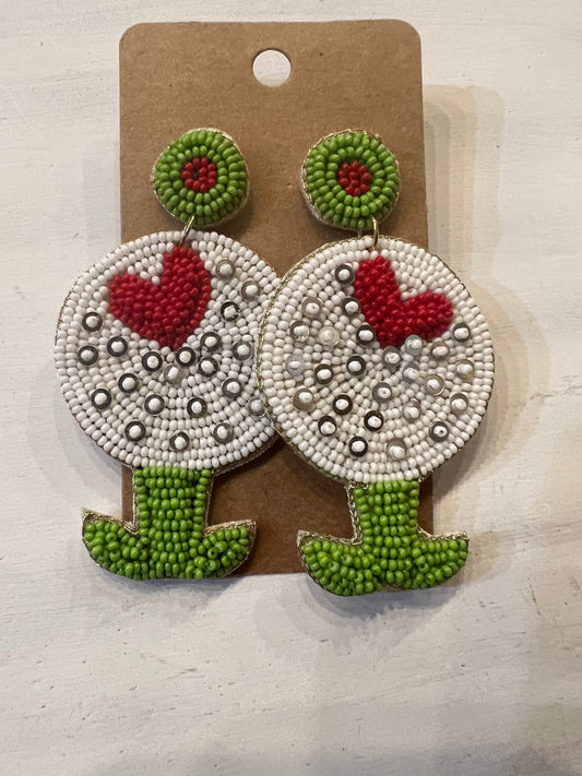 Beaded earrings in the shape of golf balls on a tee, with a heart.