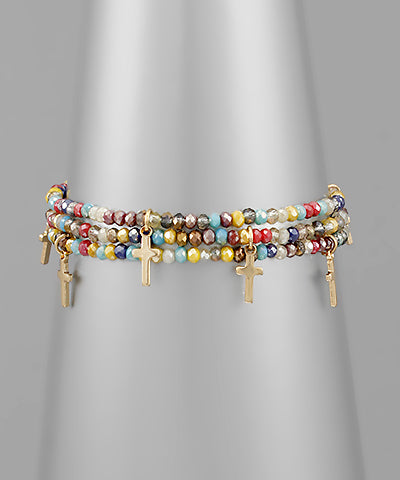 Beaded multicolored cross bracelet with cross charms.