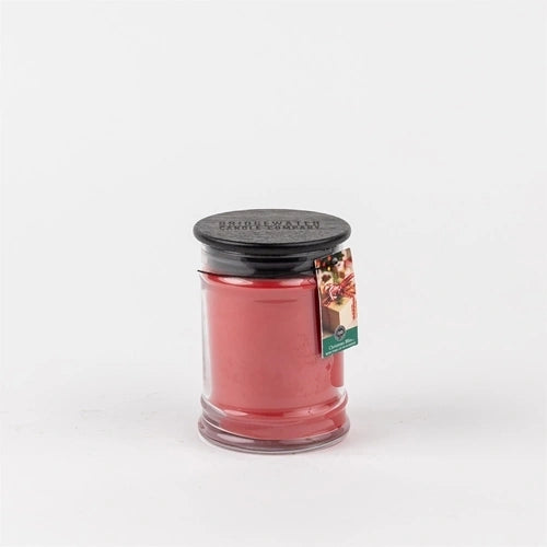 Red "Christmas Bliss" 8 oz. holiday jar candle.