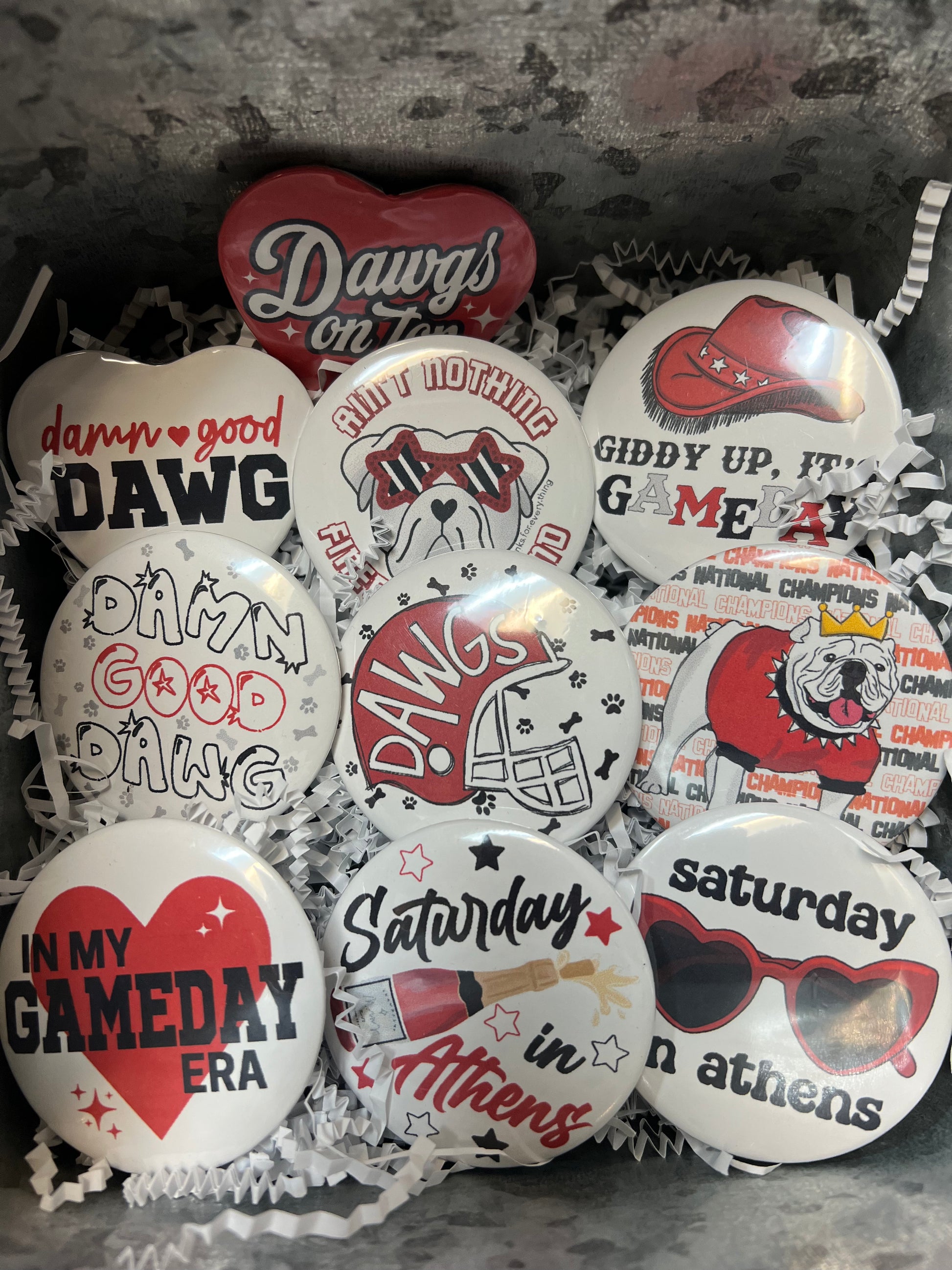 Assorted UGA buttons.