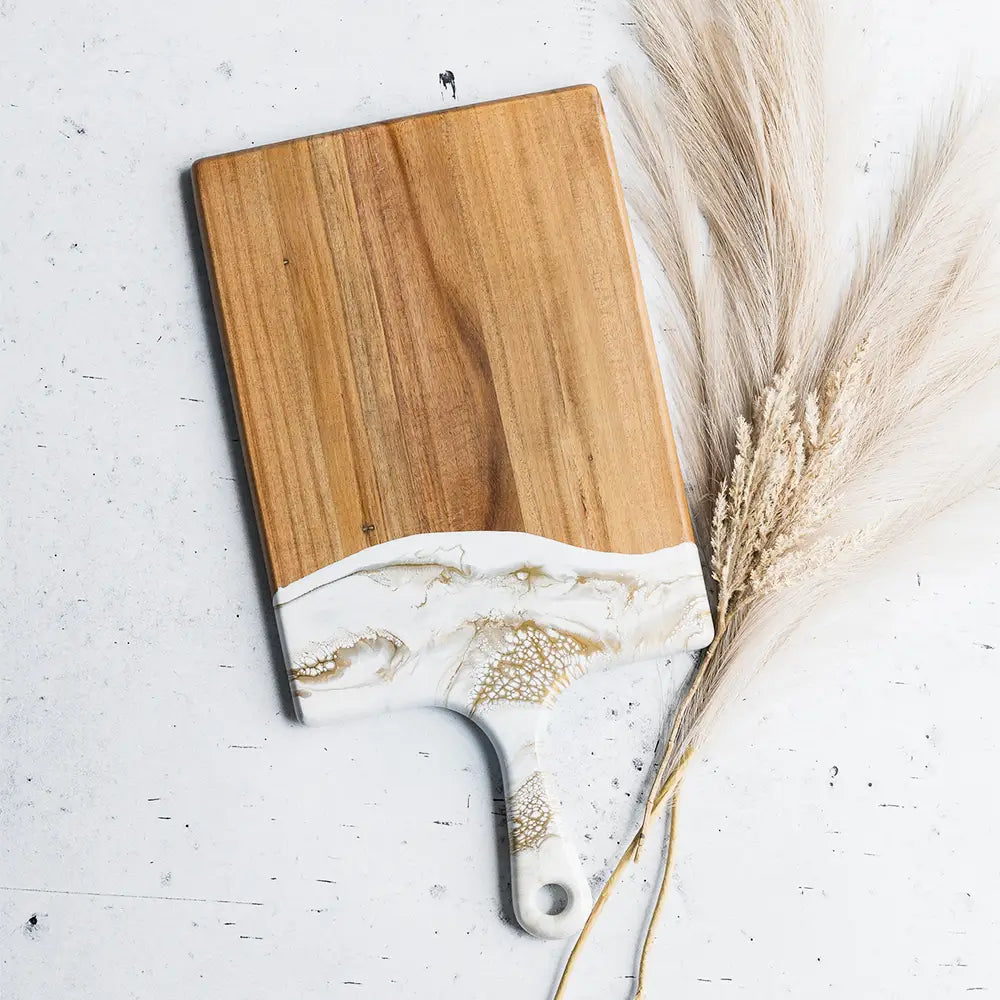 Square white and gold marble dipped board with handle.