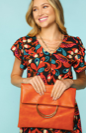 Rust orange Metal Handle Folded Clutch.