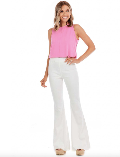 Model featuring white wash, flare jeans.