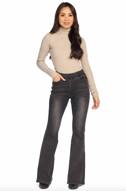 Model featuring dark wash flare jeans.