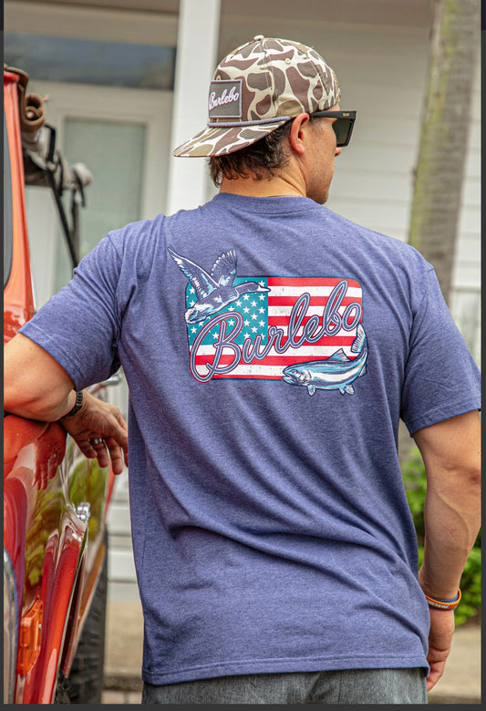 Model featuring men's blue Burlebo tee with an American flag.