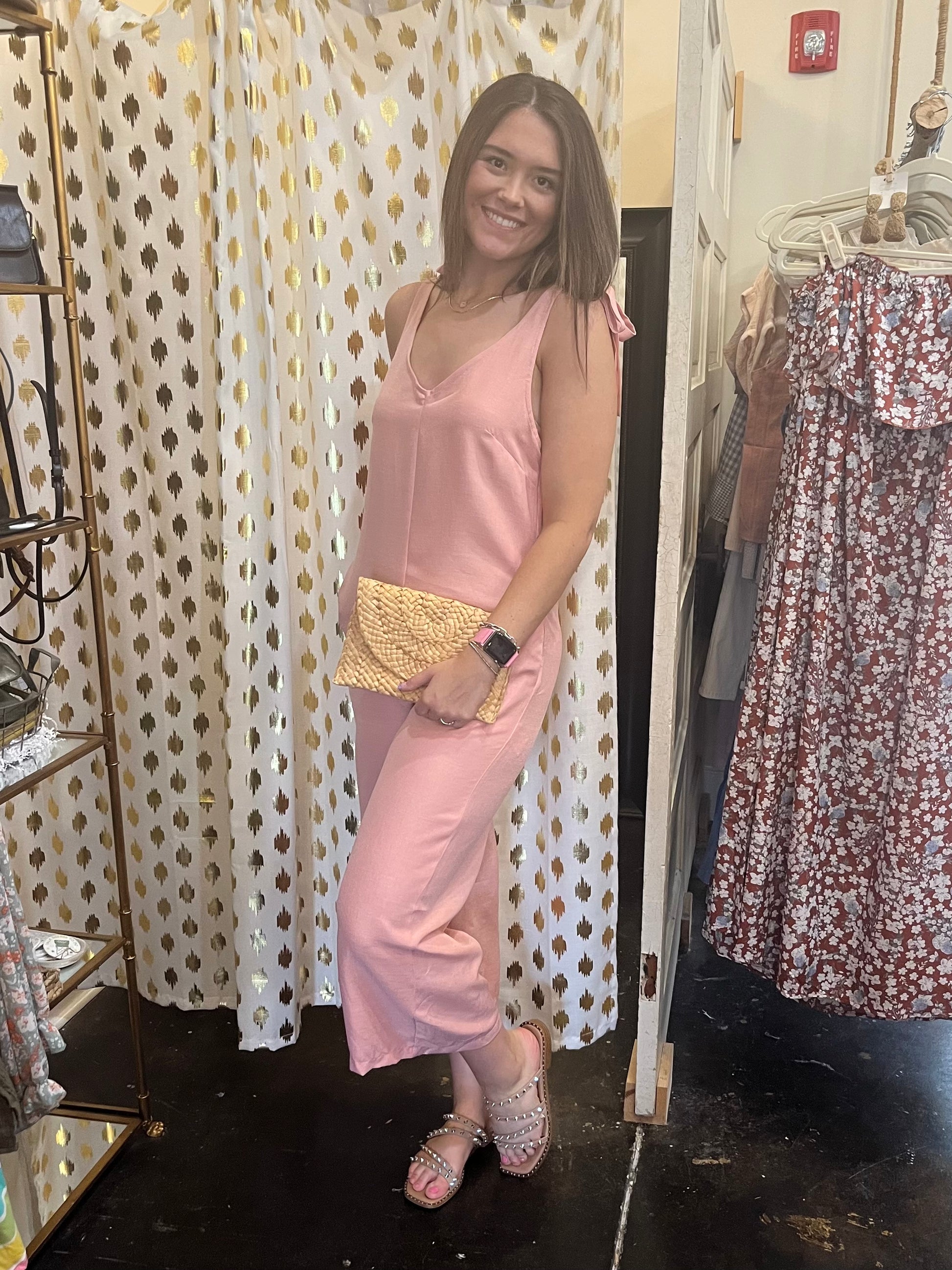 Model featuring pink linen jumpsuit.
