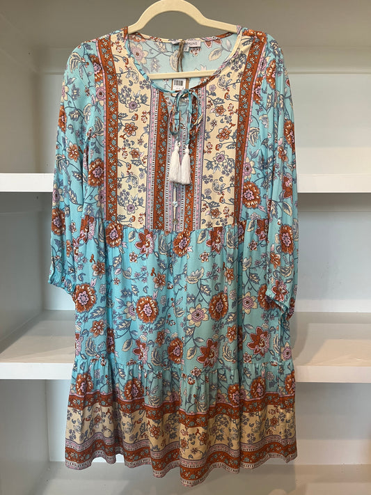 Flowy, long sleeve patterned dress.
