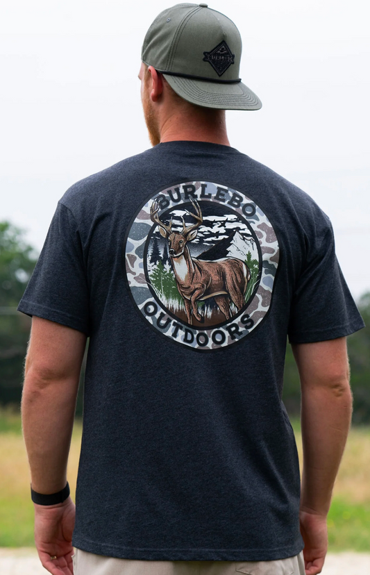 Model wearing Burlebo Outdoors t-shirt with a circle trimmed in camo, with a deer.