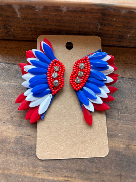 Wing shaped red, white, and blue earrings.