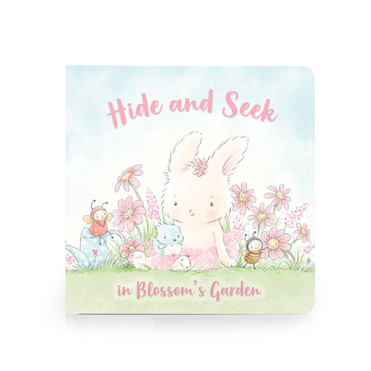 A small book with a bunny in a field of flowers on the cover. "Hide and Seek".