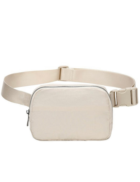 Beige belt bag. Silver colored zipper.